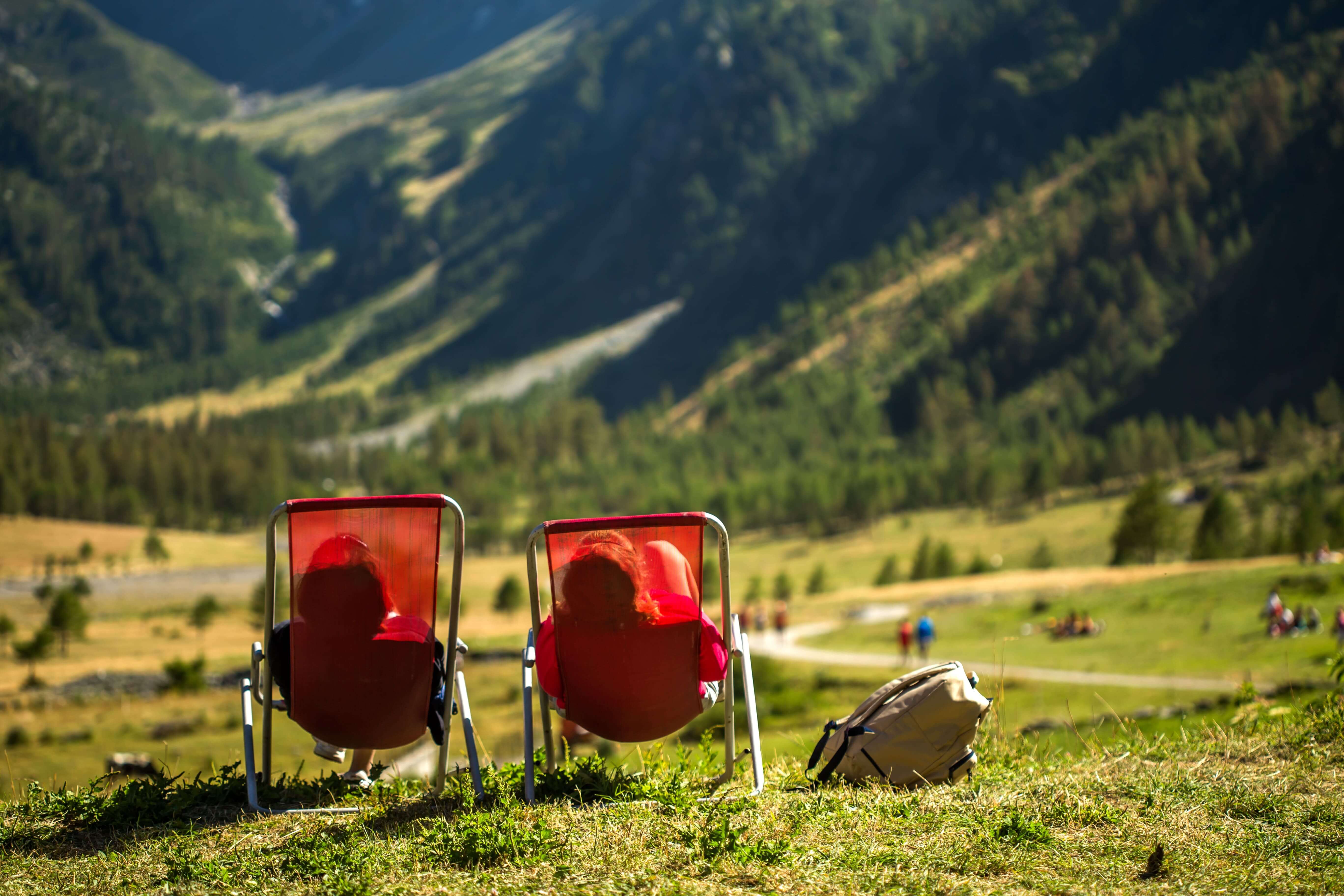 grassy-field-with-two-people-laying-chairs-enjoying-view-min (1).jpg